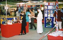 Business visitors browsing British export catalogues